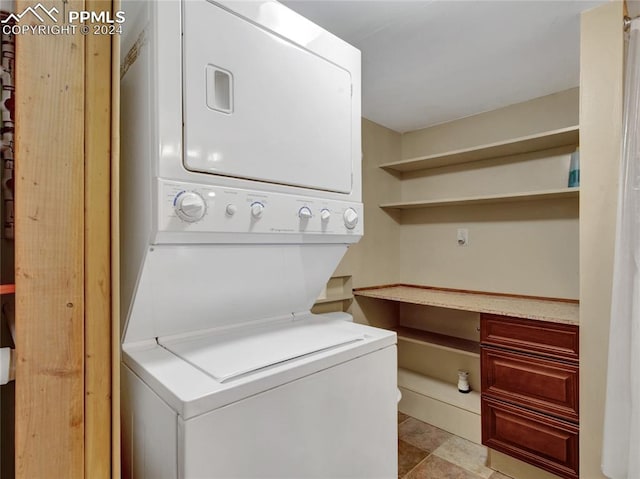 laundry area featuring stacked washer and dryer