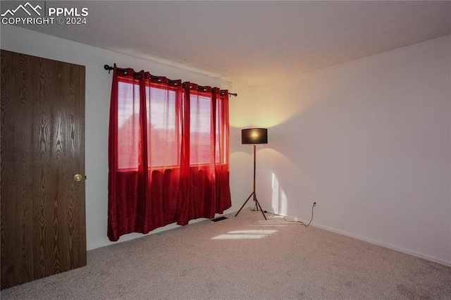 empty room featuring carpet flooring