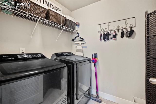 clothes washing area featuring washer and dryer