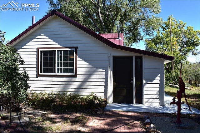 exterior space featuring metal roof