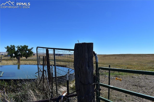 exterior space featuring a rural view and a water view