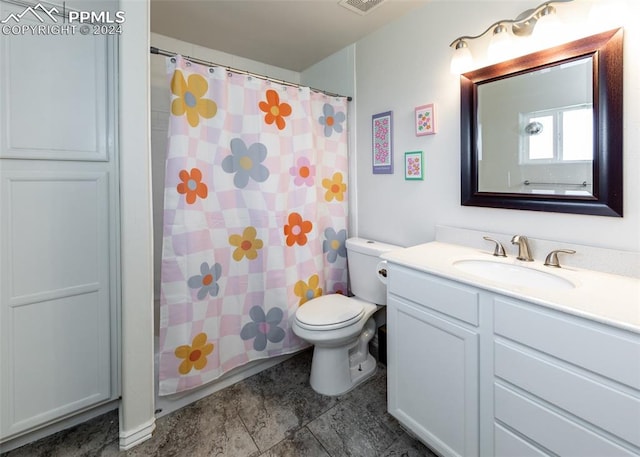 bathroom featuring walk in shower, vanity, and toilet