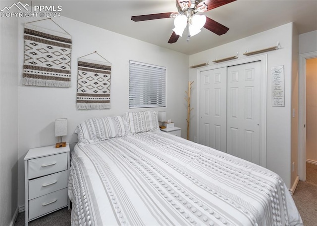 bedroom featuring ceiling fan, dark carpet, and a closet