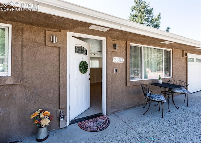 property entrance featuring a garage