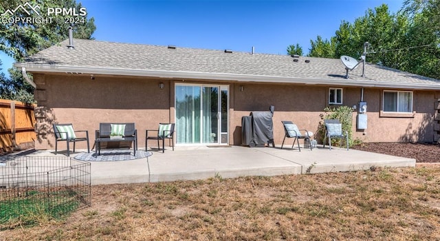 back of property with a patio area