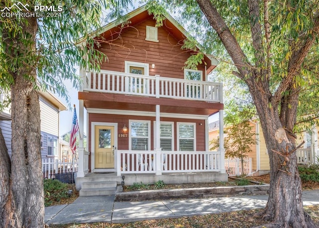 view of front of home with a balcony and covered porch