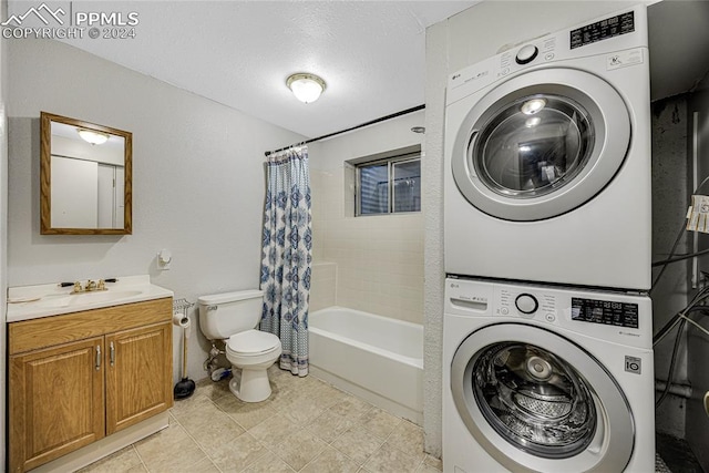 washroom with stacked washer / drying machine, a textured ceiling, sink, and light tile patterned floors