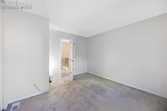 unfurnished bedroom with light carpet