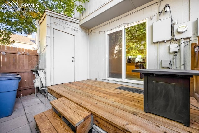 wooden deck featuring a storage shed