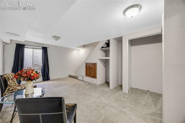 interior space featuring a textured ceiling