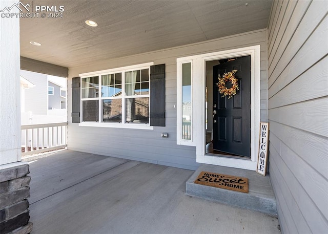 property entrance featuring covered porch