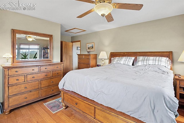 bedroom with ceiling fan and light hardwood / wood-style floors