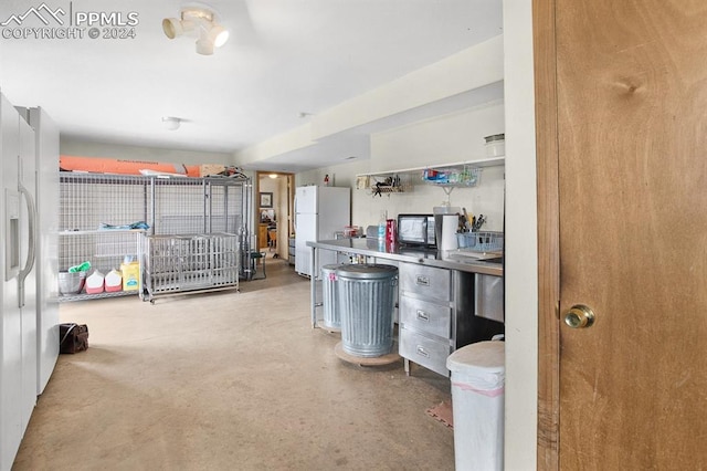 garage with white fridge