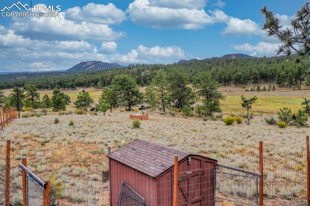 mountain view featuring a rural view