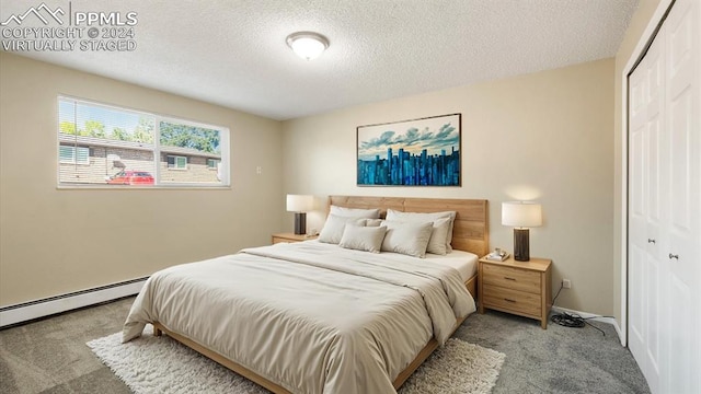 carpeted bedroom with a closet and a textured ceiling