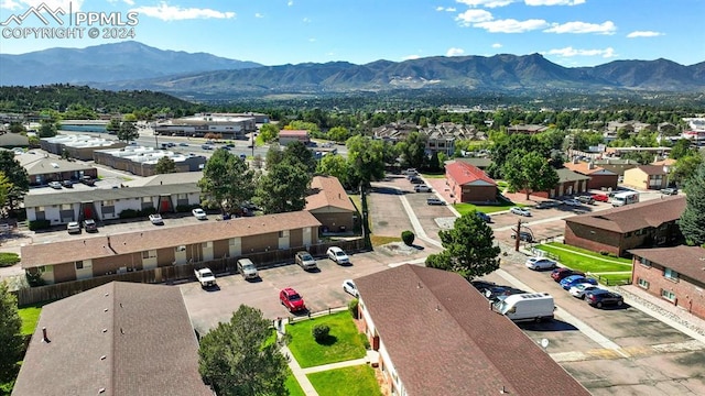 birds eye view of property featuring a mountain view