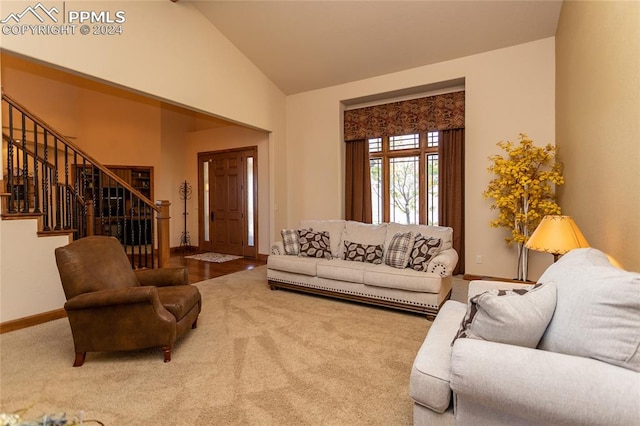 living room featuring carpet and vaulted ceiling