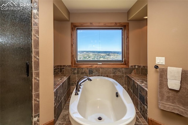 bathroom with independent shower and bath