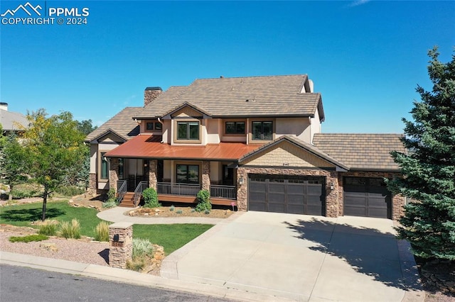 view of front of house featuring a garage and covered porch