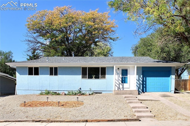 single story home featuring a garage