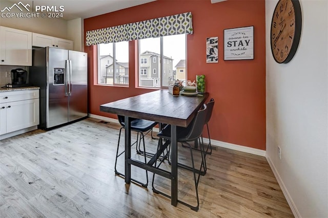 dining room with light hardwood / wood-style floors