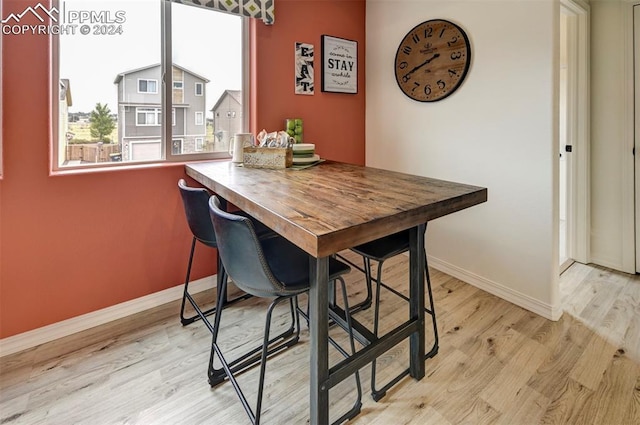 dining space with light wood-type flooring