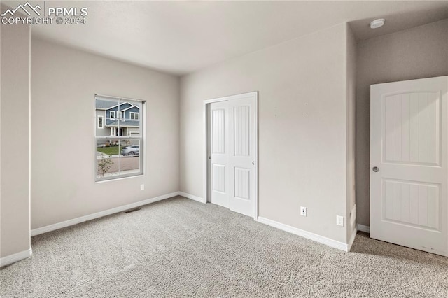 unfurnished bedroom featuring carpet