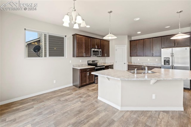 kitchen featuring dark brown cabinets, light wood-type flooring, appliances with stainless steel finishes, and sink