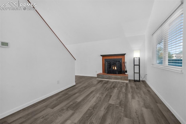 unfurnished living room featuring dark hardwood / wood-style floors