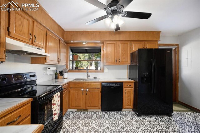 kitchen with black appliances, ceiling fan, and sink