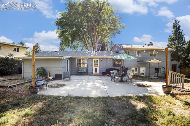 back of property with a patio area