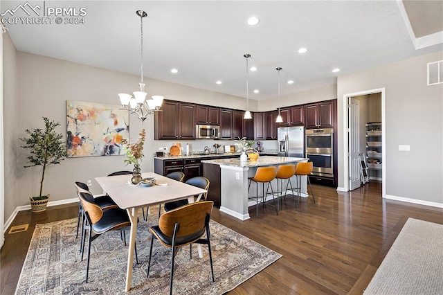 dining space featuring a notable chandelier and dark hardwood / wood-style floors