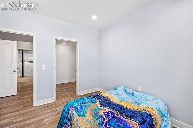 bedroom featuring wood-type flooring