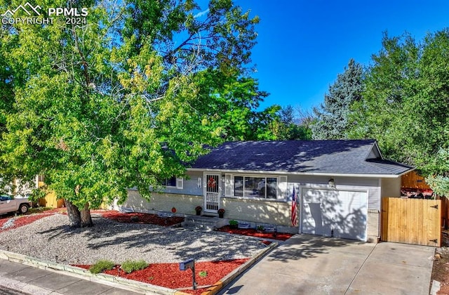 ranch-style home with a garage