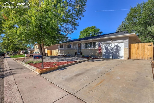 ranch-style home with a garage