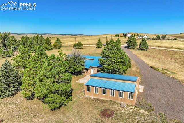 birds eye view of property featuring a rural view