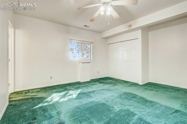 unfurnished bedroom featuring a closet, ceiling fan, and carpet floors