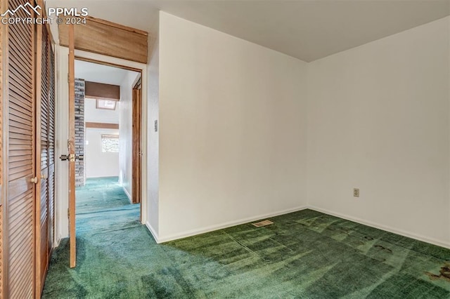 unfurnished room with carpet floors