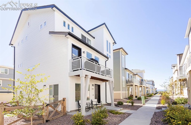 exterior space with a balcony and a patio