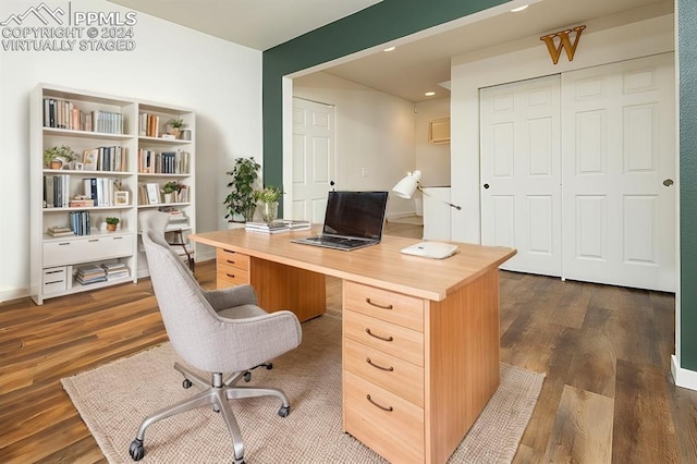 home office with dark wood-type flooring