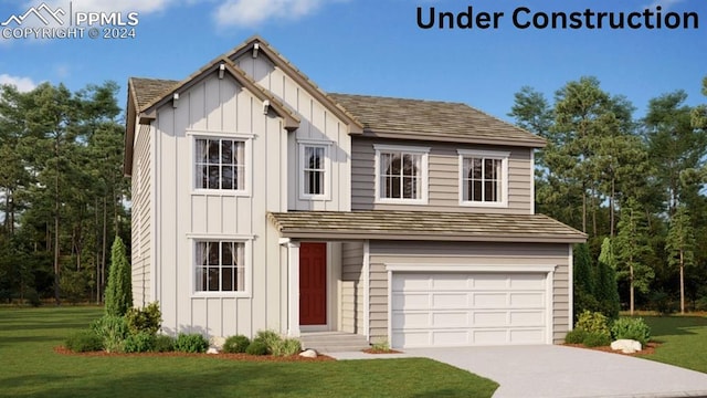 view of front facade with a garage and a front yard