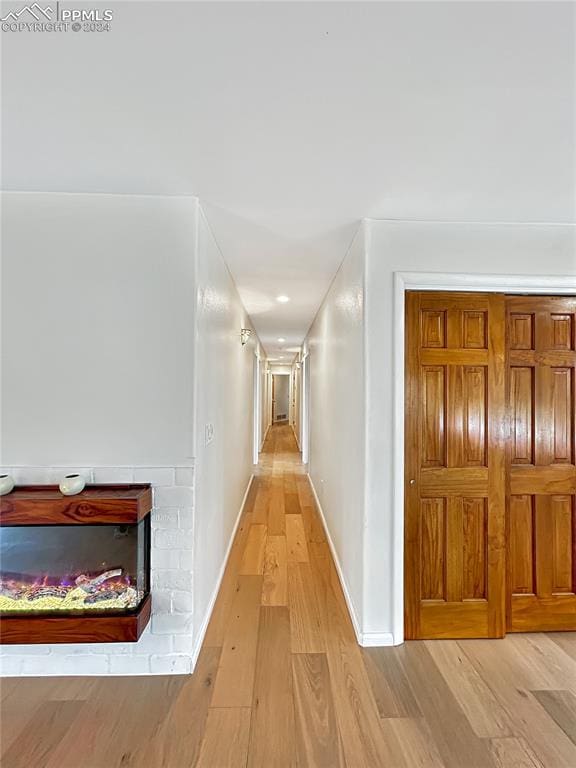 corridor featuring light hardwood / wood-style flooring