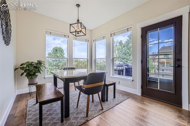 sunroom with a chandelier