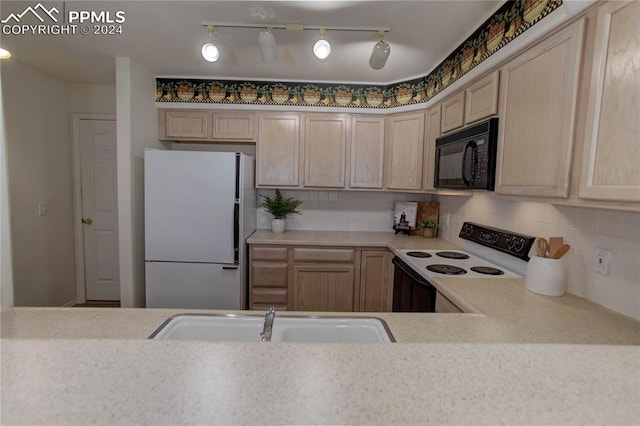 kitchen featuring light brown cabinets, backsplash, sink, and white appliances