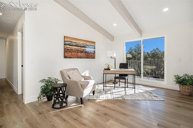 office area featuring vaulted ceiling with beams and hardwood / wood-style flooring