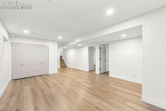 basement featuring light hardwood / wood-style flooring