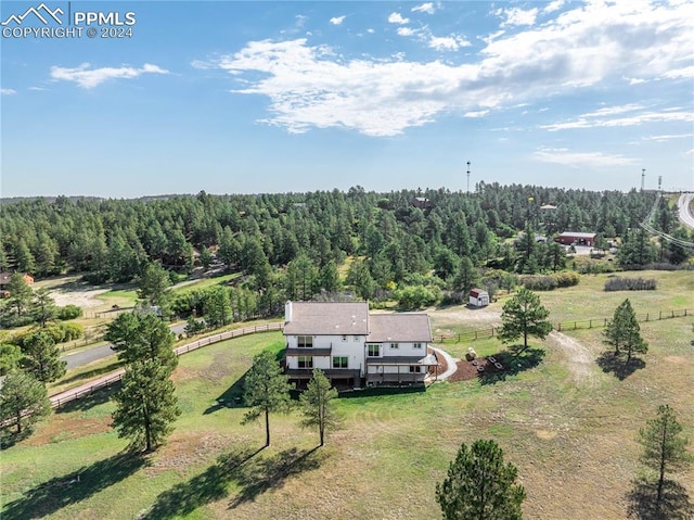 birds eye view of property with a rural view