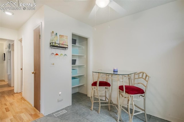 dining area featuring ceiling fan and hardwood / wood-style flooring