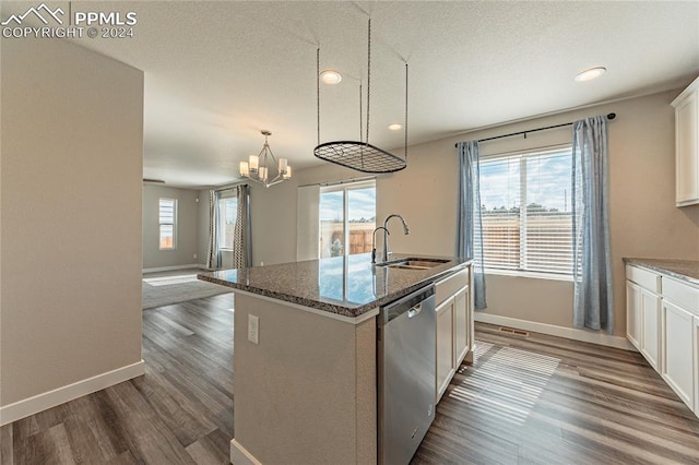 kitchen with white cabinetry, an island with sink, dishwasher, dark hardwood / wood-style floors, and sink