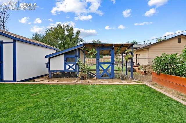 view of outdoor structure with a lawn